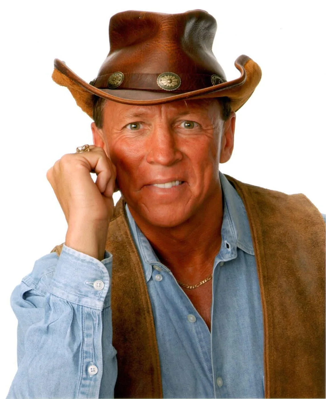 Jim Wand, relaxed, in a leather cowboy hat and denim shirt